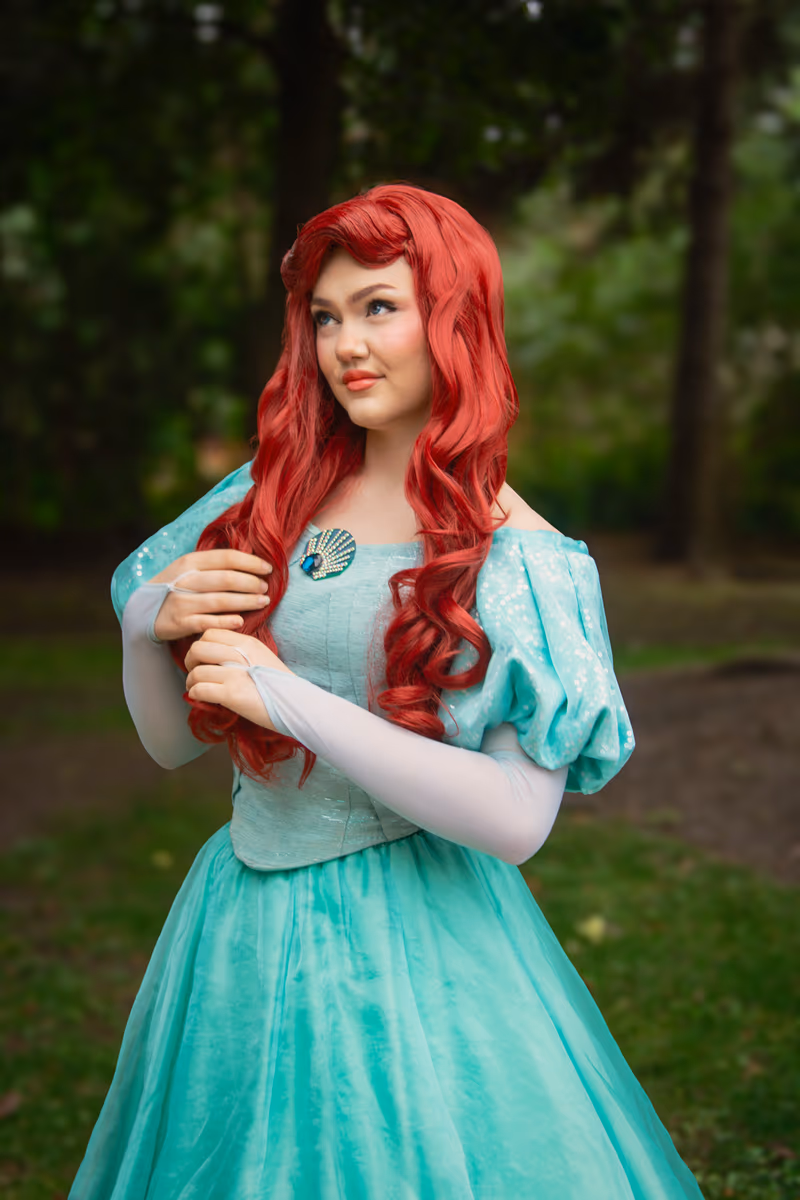 Ariel teal dress performer in a spring garden | Magic At My Door