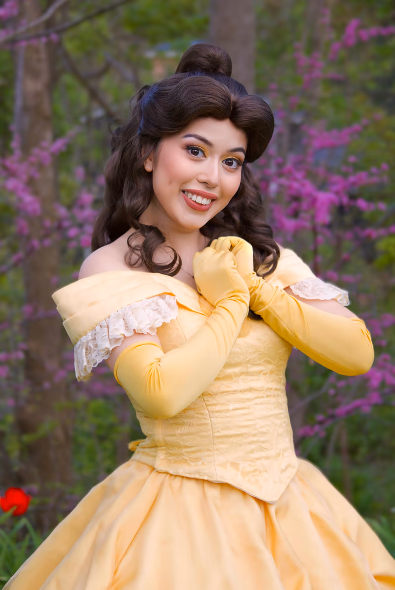 Belle princess character smiling in spring blossoms | Magic At My Door
