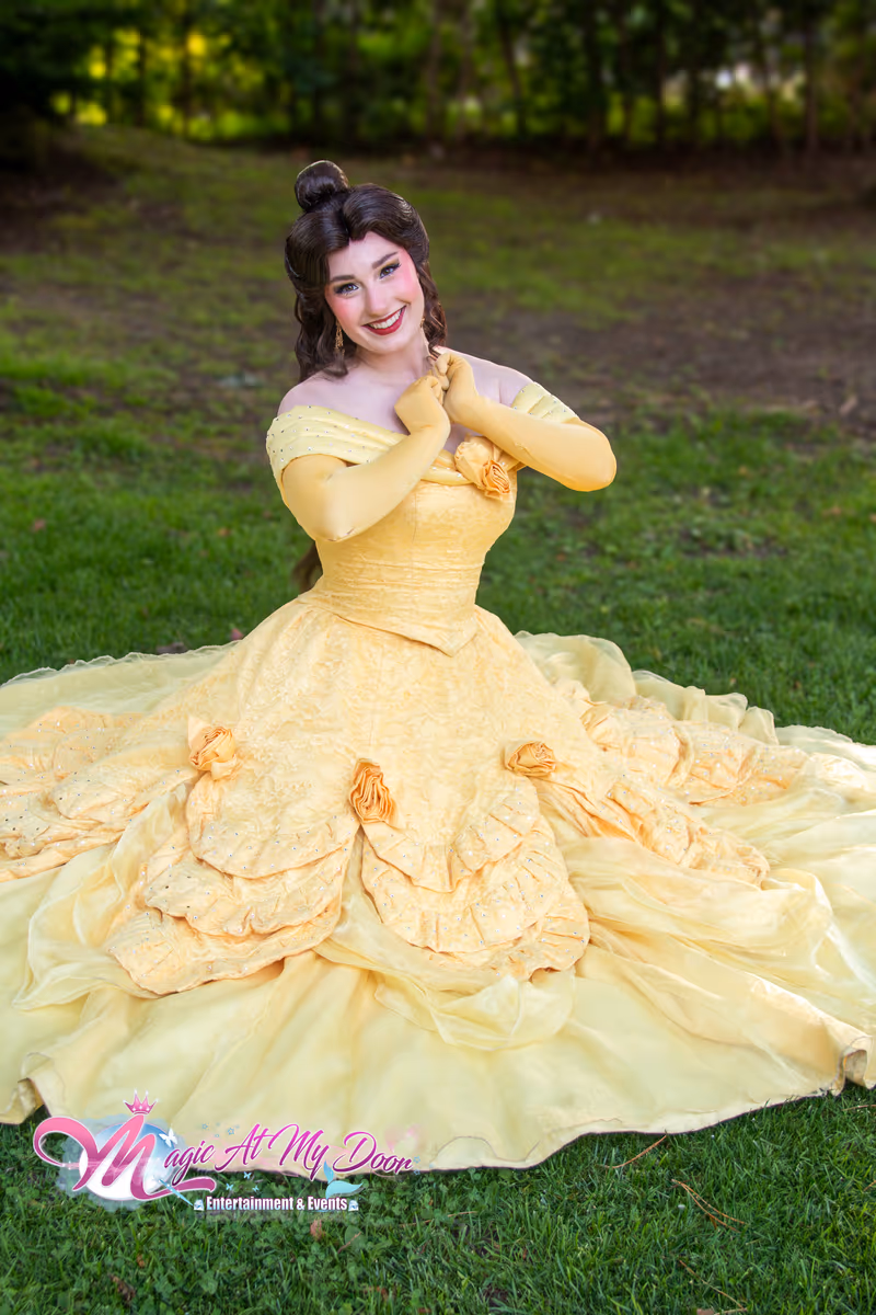 Belle seated with her ball gown spread | Magic At My Door