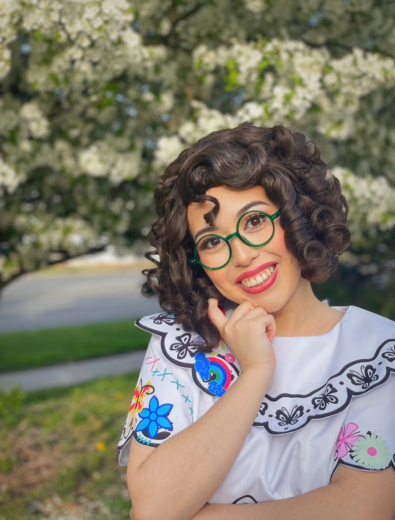 Mirabel character entertainer with glasses and curly hair | Magic At My Door