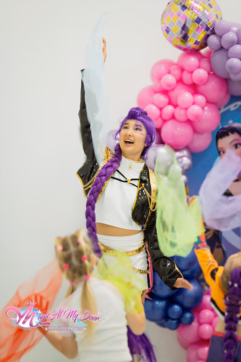 Rumi striking a pose at a Toronto party | Magic At My Door